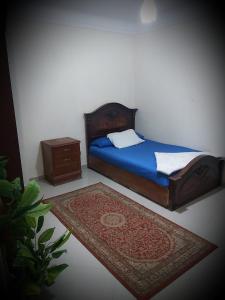 Łóżko lub łóżka w pokoju w obiekcie ميامي جلوبال