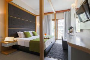 Ένα ή περισσότερα κρεβάτια σε δωμάτιο στο La Piscine Art Hotel, Philian Hotels and Resorts