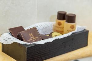 a wooden box with medicines and a book on it at Costa Dorada in Cala Gonone