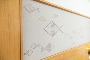 a white board with drawings on it at Costa Dorada in Cala Gonone