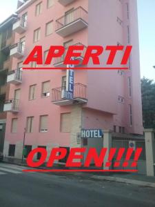 a pink building with a sign for a hotel at Hotel Bristol in Sesto San Giovanni