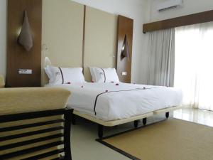 Postel nebo postele na pokoji v ubytování Iris Hotel
