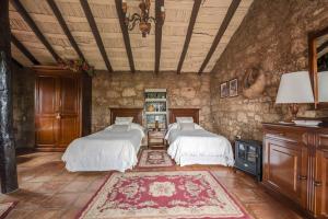 Кровать или кровати в номере Casa Rural El Moral