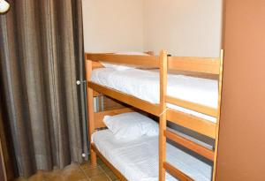 a couple of bunk beds in a room at Scierie A Meya 118 in Vercorin