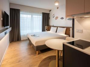 Postel nebo postele na pokoji v ubytování Adagio access Brussels Delta