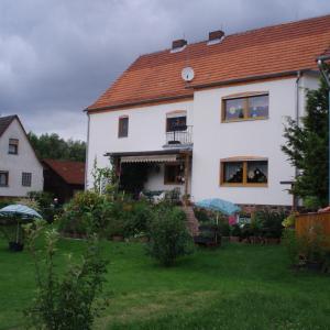 a white house with a red roof at Haus-in-Gemuenden-an-der-Wohra in Gemünden an der Wohra