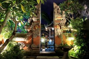 a display of a building with trees and plants at EUFORIA Guest House in Canggu