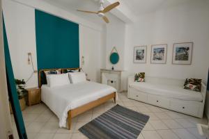 a bedroom with two beds and a ceiling fan at Old Town Antibes Apartment in Antibes