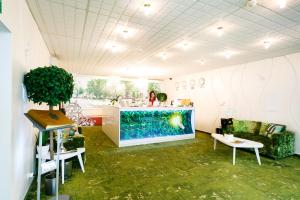 a room with a counter with a fish tank in it at Petrovsky Passage Voronezh Center in Voronezh