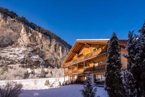 a lodge in the mountains in the snow at Apartment Staubbach, Best views, Spacious, Family friendly in Lauterbrunnen