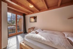 Ένα ή περισσότερα κρεβάτια σε δωμάτιο στο Apartment Staubbach, Best views, Spacious, Family friendly