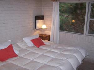 Una cama o camas en una habitación de Rincon del Sur