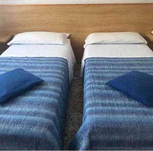 Letto o letti in una camera di Albergo Moderno