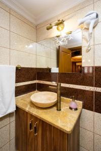 a bathroom with a sink and a mirror at Kervanchi in Istanbul