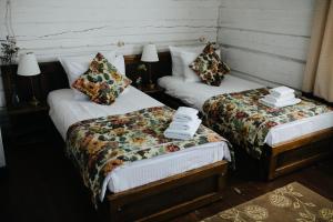 Кровать или кровати в номере Бутик Отель Маруся