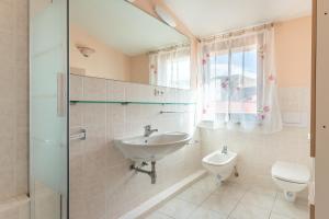 a bathroom with a sink and a toilet at Casa Vista mare Bosa/Magomadas in Magomadas +23 photos