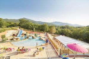 a water park with a slide and a pool at Camping des Alberes in Laroque-des-Albères