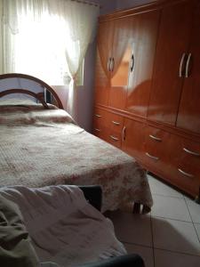Cama ou camas em um quarto em Casa de Hospedagem em São João Batista do Glória