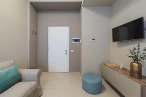 A television and/or entertainment centre at Contempora Apartments - Cavallotti 13 - B52