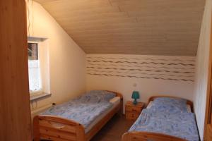 Ein Bett oder Betten in einem Zimmer der Unterkunft Ferienwohnung Maas 