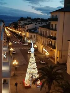 a christmas tree on a city street at night at Carpe Diem in Lamezia Terme