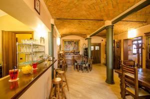 a large room with a bar and a dining room at Hotel Corte Vecchia in San Prospero  +47 photos