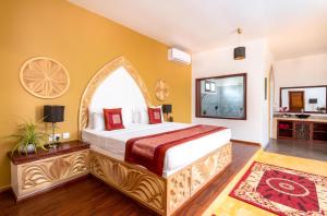 מיטה או מיטות בחדר ב-Natural Kendwa Villa