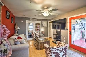 a living room with a couch and a ceiling fan at Stylish Suburban Getaway, 10 Miles to Royal Mtn! in Johnstown