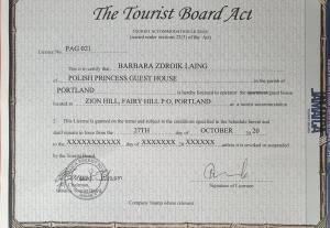 a ticket for the tourist board act with a document at Polish Princess Guest House in Port Antonio