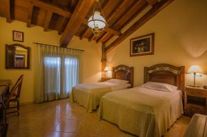 Un pat sau paturi într-o cameră la Hotel Corte Vecchia