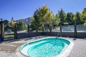 a small swimming pool in the middle of a backyard at Snowcreek V #774 condo in Mammoth Lakes