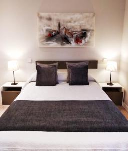 
Cama o camas de una habitación en Cervantes Apartamentos
