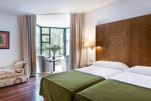 Postel nebo postele na pokoji v ubytování Parador de Limpias