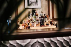 a bar with a display of bottles of alcohol at El Llorenc Parc de la Mar - Adults Only (+16) in Palma de Mallorca