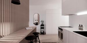 a kitchen with a white counter top and white cabinets at New and cozy apartment in the centrum of Oulu in Oulu