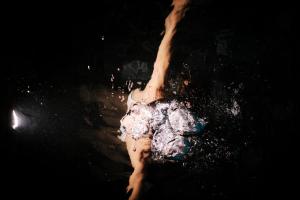 a woman in a dress dancing in the water at El Llorenc Parc de la Mar - Adults Only (+16) in Palma de Mallorca