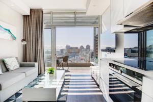 a living room with a view of the city at Backup-Powered Trendy City Sanctuary in Cape Town