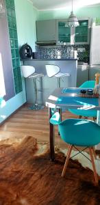 a kitchen with a table and chairs in a room at Design apartment MM in Poprad