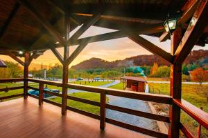 a view of a river from the porch of a cabin at Cabana Mihai in Sovata