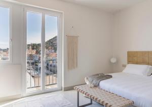 Postel nebo postele na pokoji v ubytování LA GUARDIA Hotel