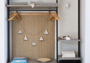 a room with a shelf with some items on it at LA GUARDIA Hotel in Giglio Porto +82 photos