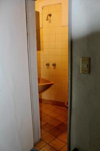 a bathroom with a tub and a sink and a shower at Hotel Bahia in Buenos Aires +94 photos