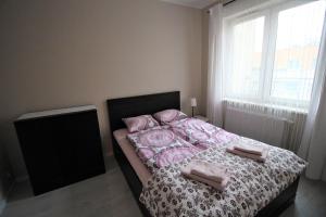 Vuode tai vuoteita majoituspaikassa Apartament Podróże Małe i Duże