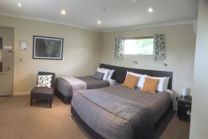 Postel nebo postele na pokoji v ubytování Kauri Motel on Riccarton