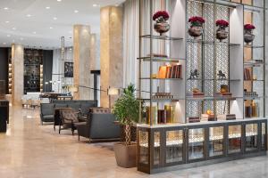 a lobby of a hotel with aasteryasteryasteryasteryasteryasteryasteryasteryastery at Hyatt Regency Sofia in Sofia