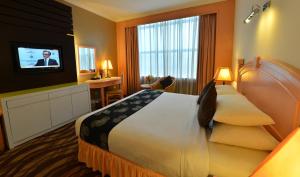 Voodi või voodid majutusasutuse Emerald Puteri Hotel toas