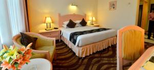 Voodi või voodid majutusasutuse Emerald Puteri Hotel toas