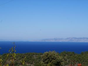 a view of a large body of blue water at Charming Holiday Home in Kritinia with Garden in Kritinía