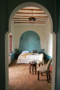 Кровать или кровати в номере Riad Soumia