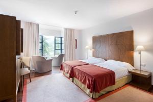 Postel nebo postele na pokoji v ubytování Parador de Limpias